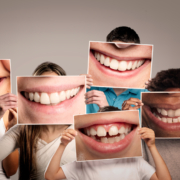 group of happy people holding a picture of a mouth smiling on a dental seo company